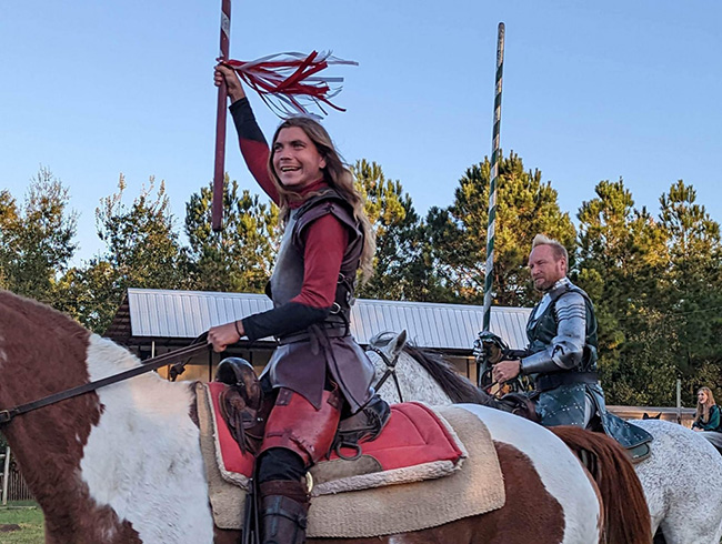 Men ready to joust on horses