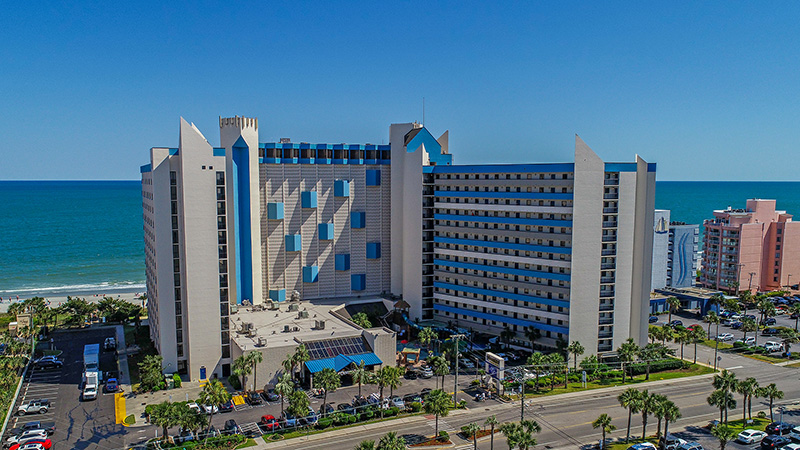 Ocean Reef Resort aerial of building with beach