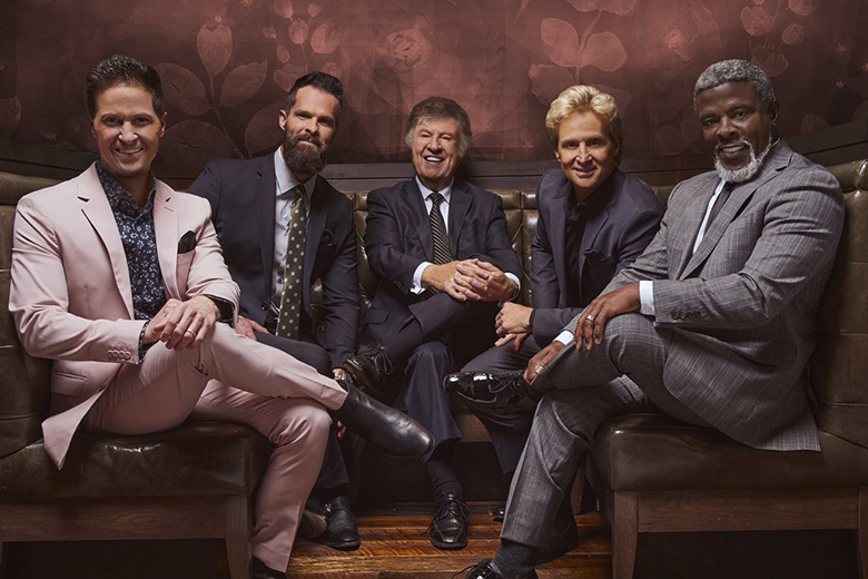 The five members of the Gaither Vocal Band sitting