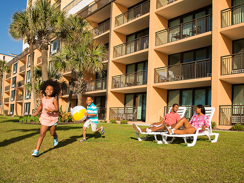 Caravelle Resort family on sunning lawn