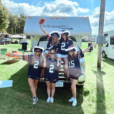 Auburns fans group with pom poms and hats