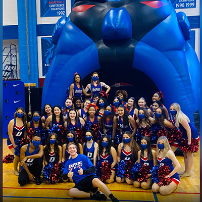 UFB DePaul cheerleaders around large Blue Demon inflatable