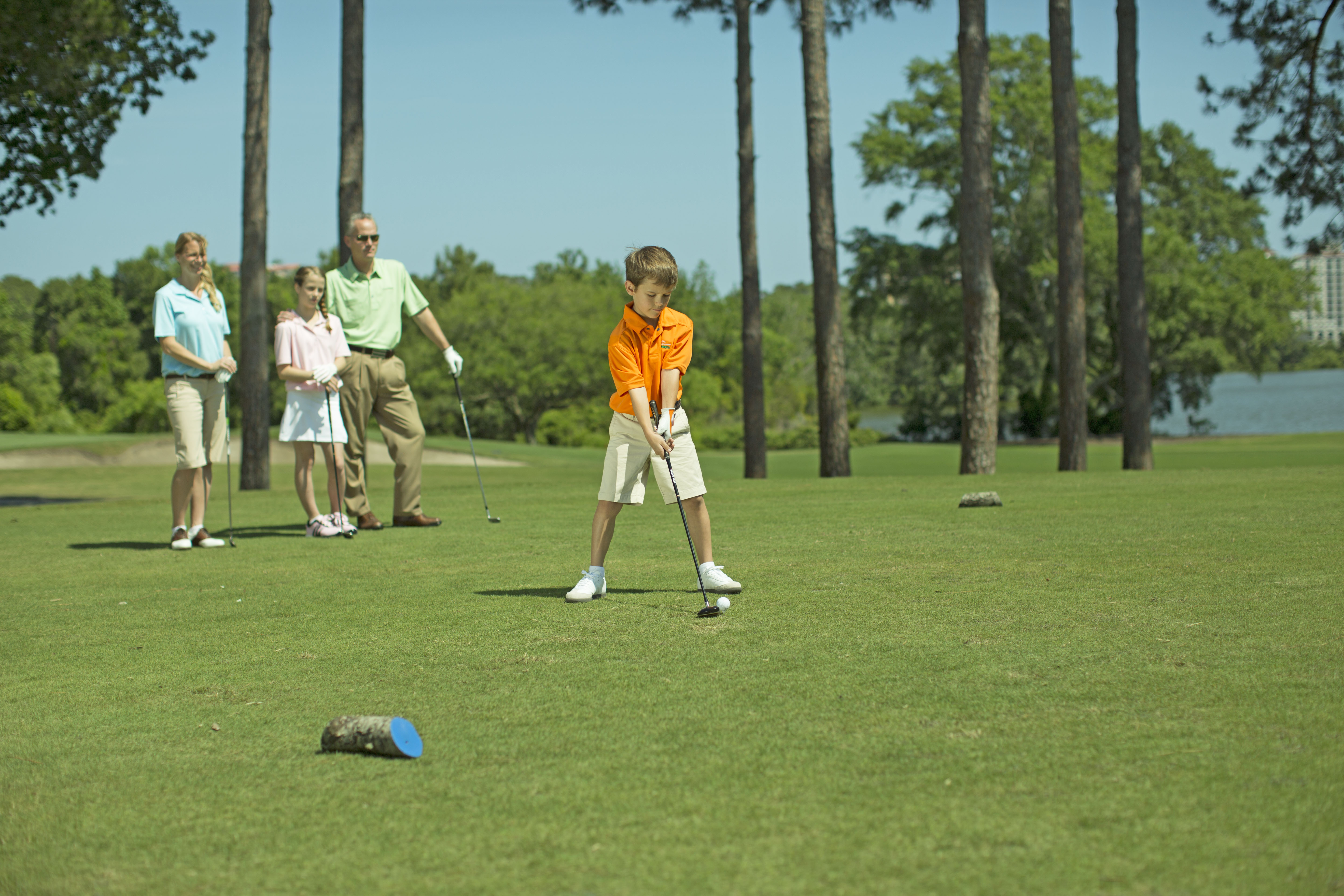 Golfing Boy Lining the Shot Up