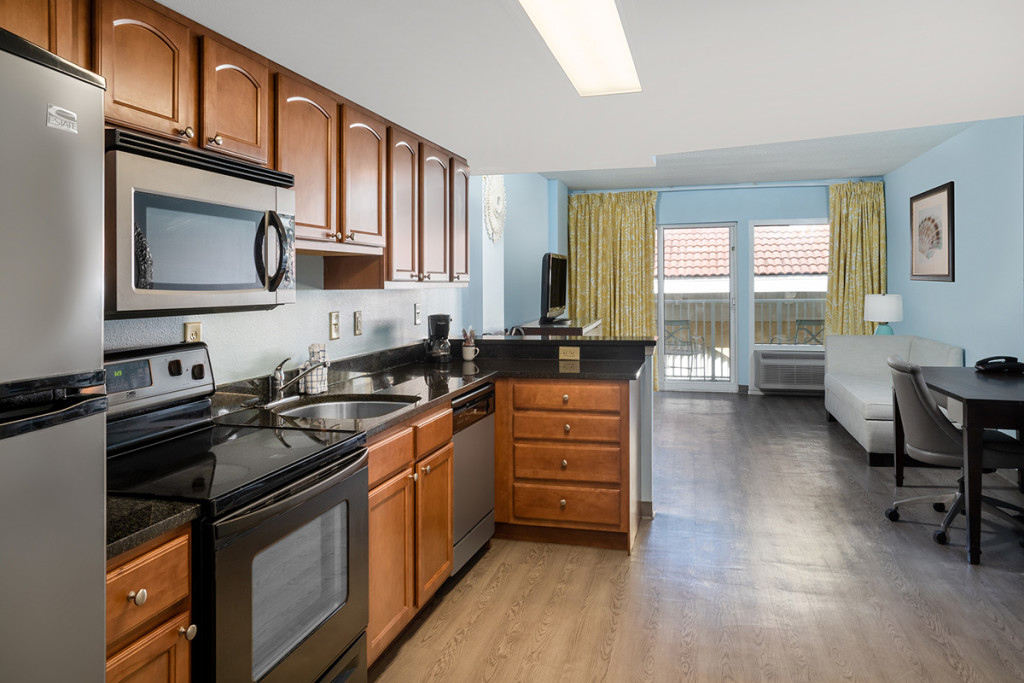 King Suite efficiency kitchen and room with balcony view