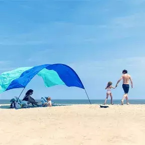 Family on beach with Shibumi Shade
