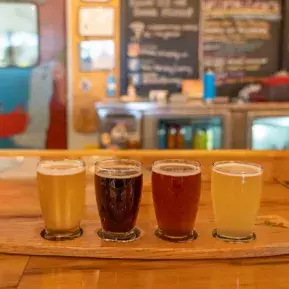Makai Brewing beer flight sitting on bar