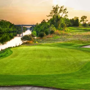 Love Course at sunet with green and river along the side