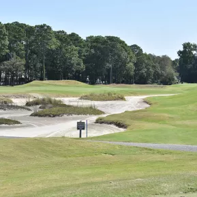 Prestwick Country Club rolling greens with sandtrap