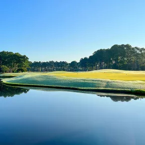 World Tour Golf sunrise view of green with lake