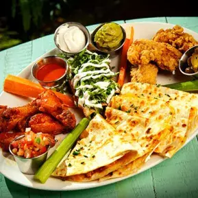 Senor Frogs delicious enchilada, wings and jalapeno platter
