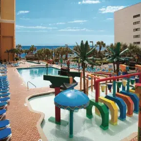 Caravelle Resort Block-Long Poolscape