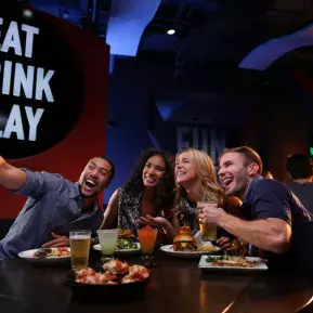 Friends taking selfie at Dave & Buster's