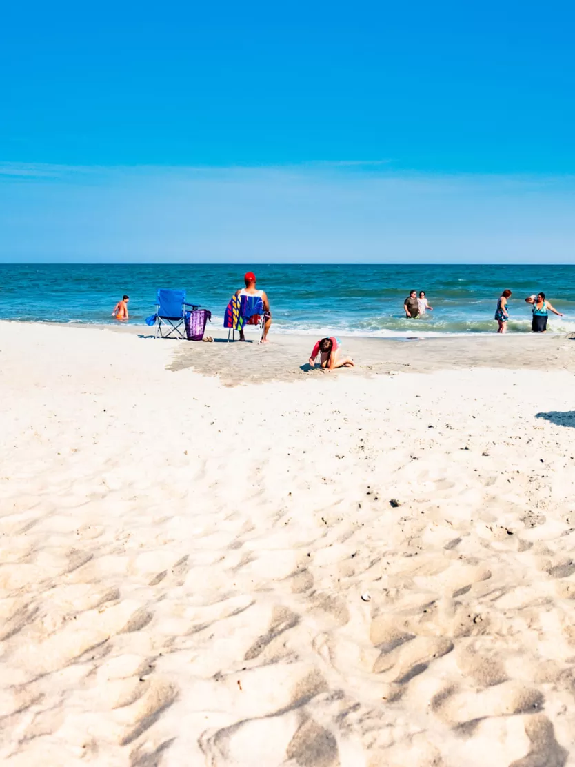 People relaxing in front of the ocean in Myrtle Beach.