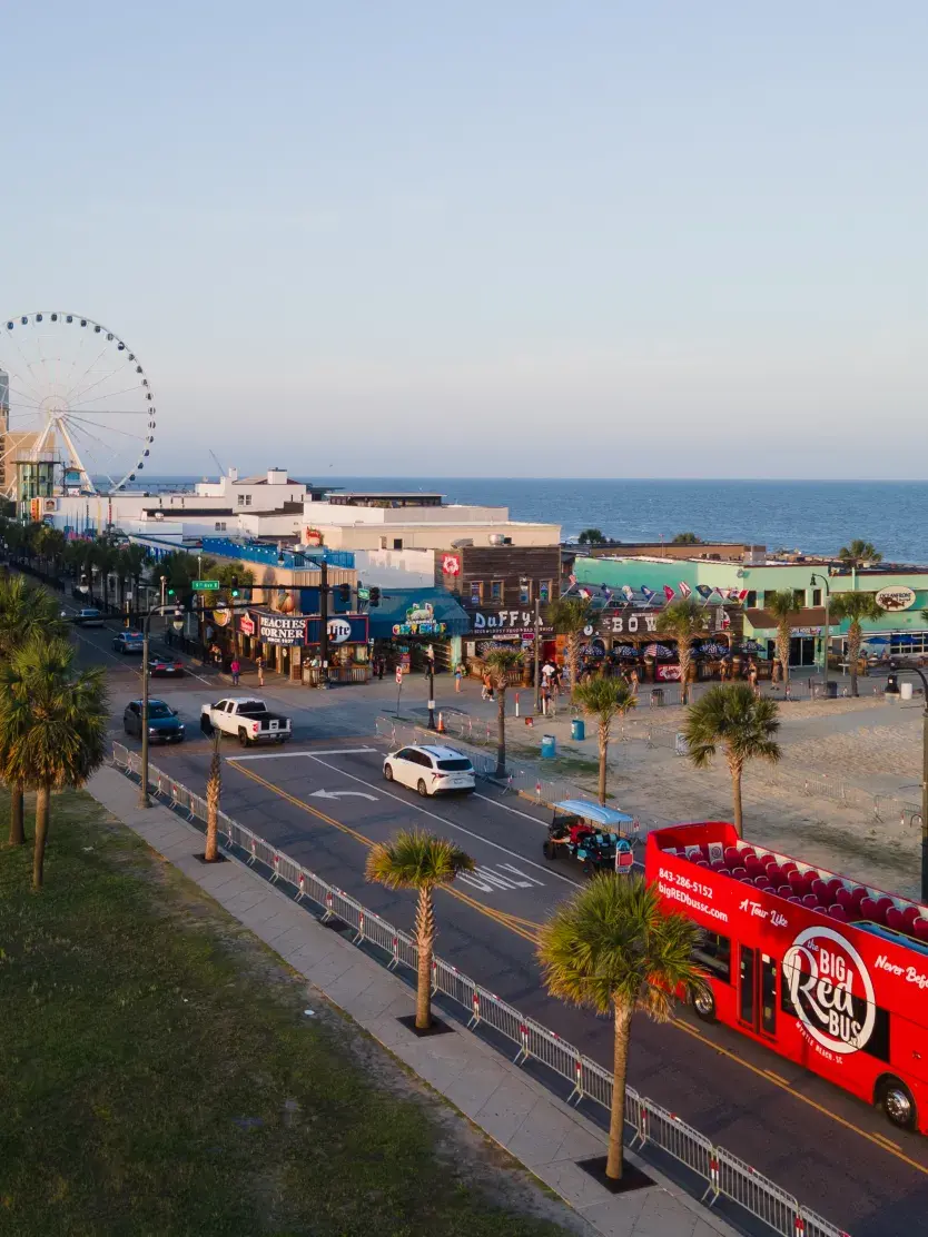 Aerial Shot of Big Red Bus Tour on Ocean Blvd