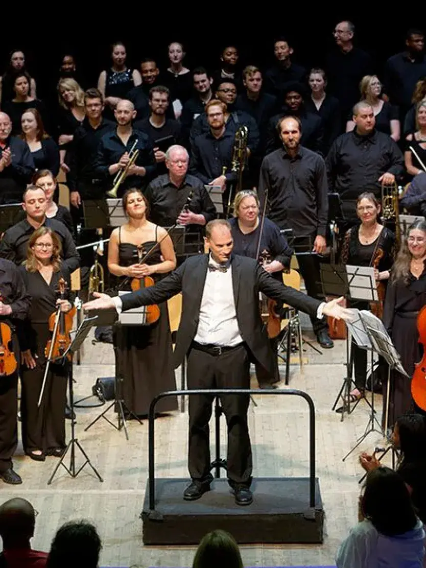 The conduction of an orchestra at the Grand Strand Music Festival.