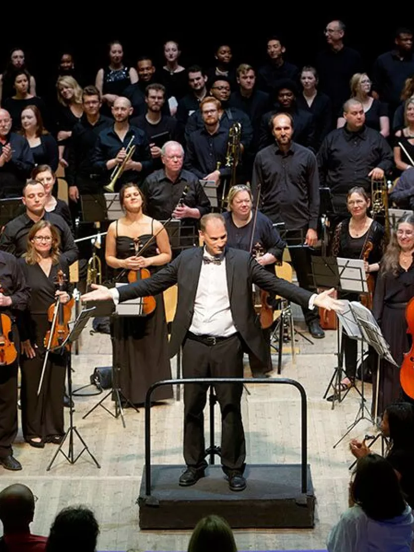 The conduction of an orchestra at the Grand Strand Music Festival.