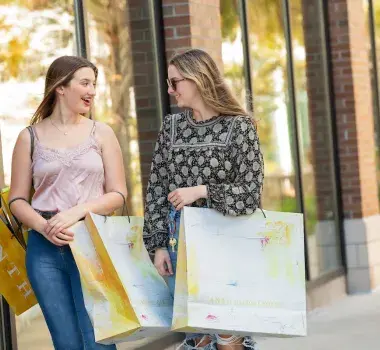 Two Girls Shopping Together at Market Common
