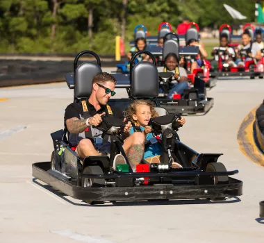 Go-Carting at Broadway Grand Prix A father and sone race in a Go-Cart at Broadway Grand Prix