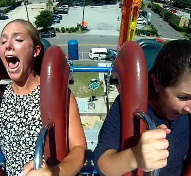 Girls screaming on Slingshot attraction in downtown Myrtle Beach