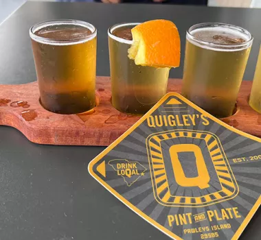 Quigley's beer flight with branded coaster