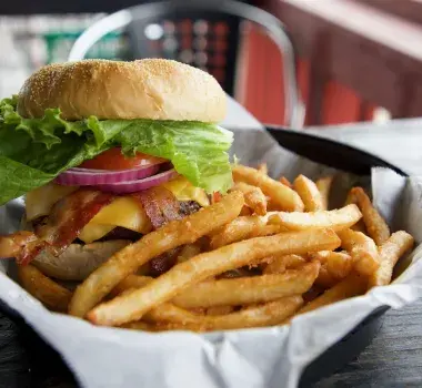 Cheeseburger and fries on display