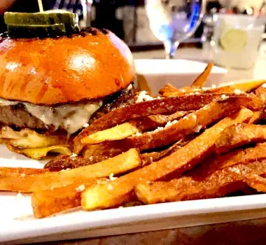 Cheeseburger and fries on display