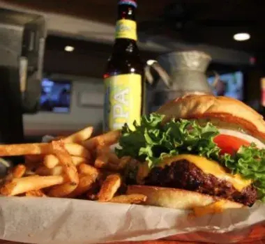 Cheeseburger and fries on display