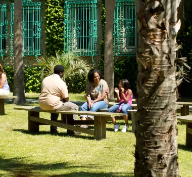 People sitting on benches at Atalaya Castle