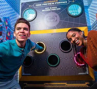 Escape Game Timeliner room two people with hands in tubes, what's in there?