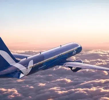 Breeze Airways plane flying over clouds