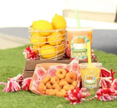 Lemon and Dough display complete with lemonade and mini donuts.