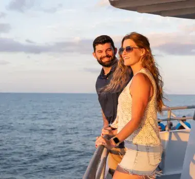A couple enjoys the romantic Crazy Sister Marina sunset cruise in Murrells Inlet