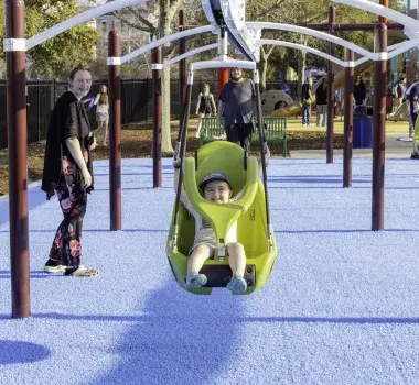 A child rides on the swing at Savannah's playground.