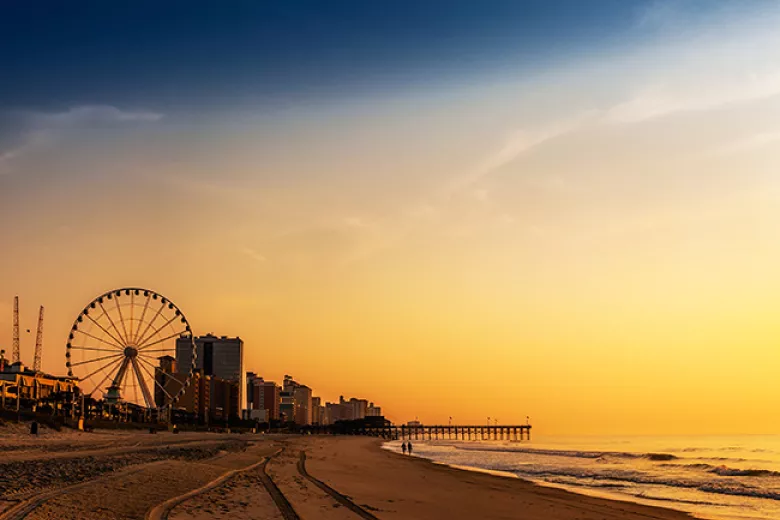Booe Realty - sunrise on the beach with SkyWheel