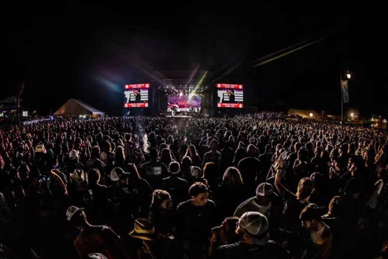 CCMF 2022 night time show of the stage through crowd