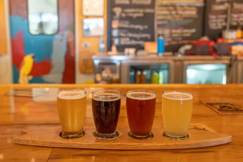 Makai Brewing beer flight sitting on bar