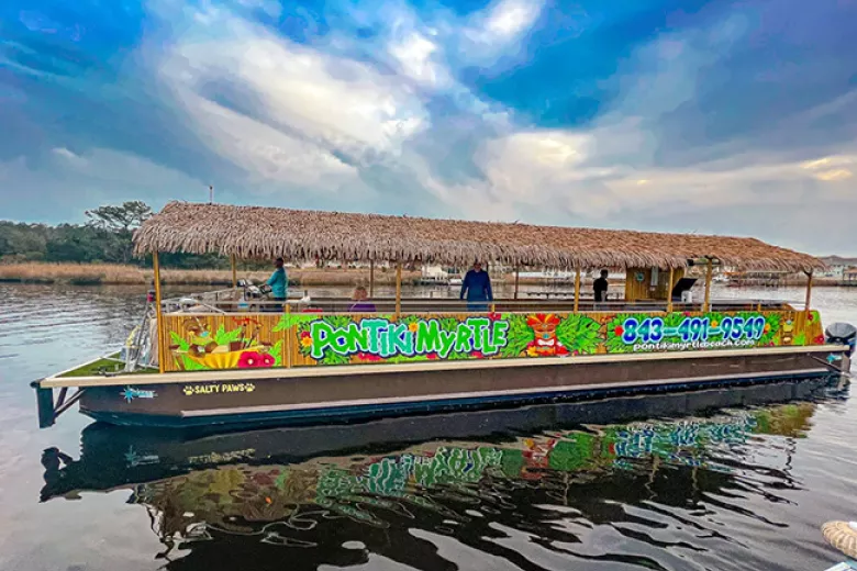 PonTiki Myrtle Beach tour boat with tiki roof and colorful graphics