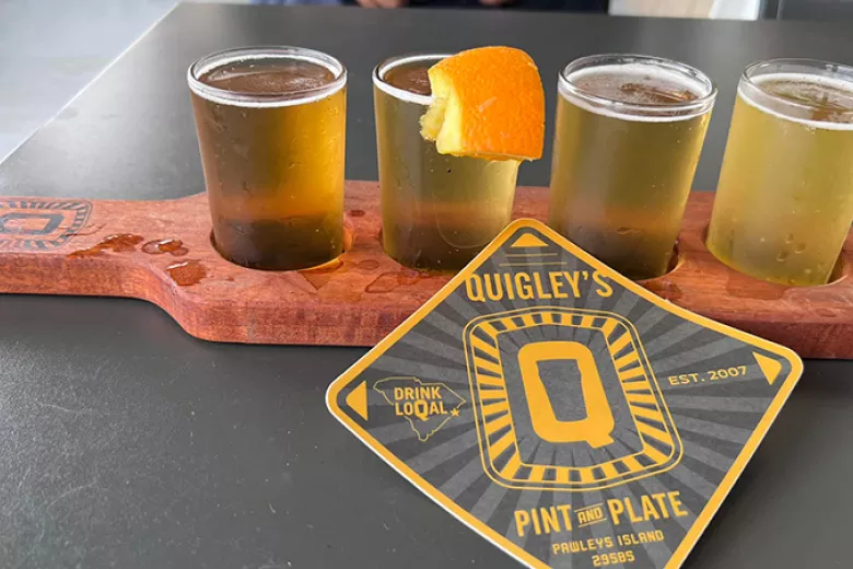 Quigley's beer flight with branded coaster