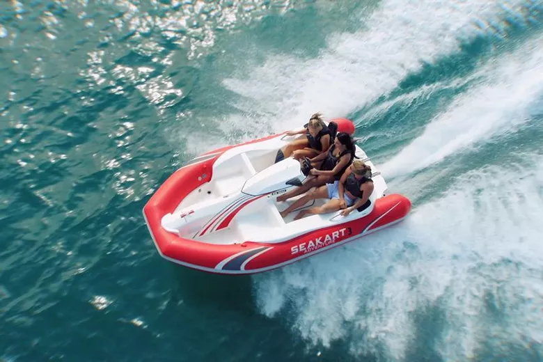 Aerial view of Seakart on the ocean with three girls