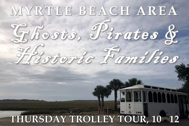 White trolley sitting along the inlet in Murrells Inlet