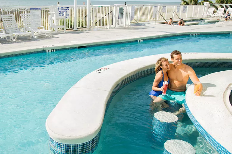 hotel BLUE couple at swim up bar