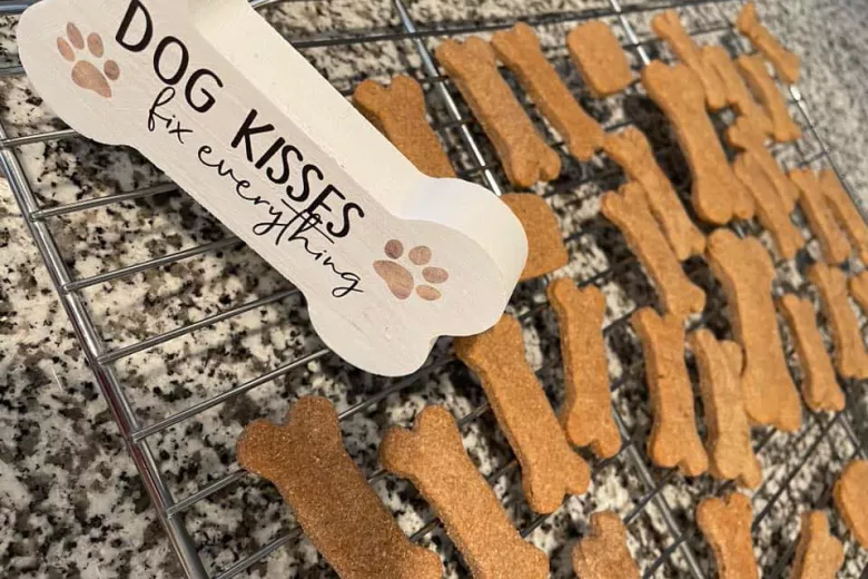 Dog treats with Dog Kisses sign in shape of bone