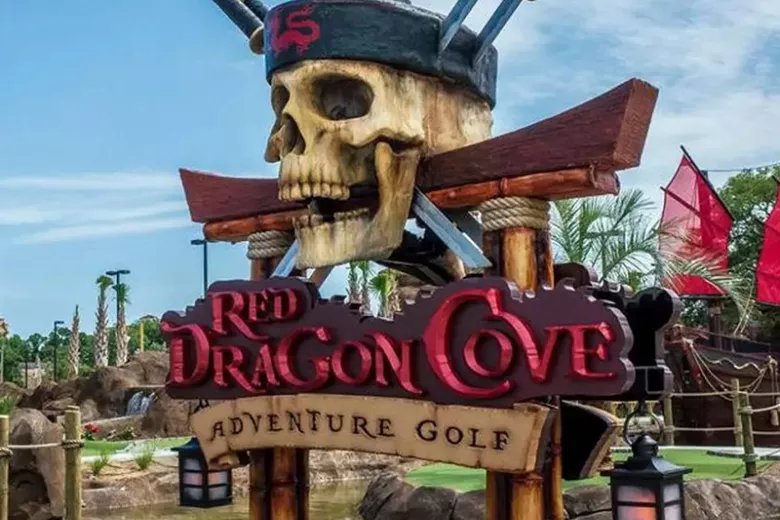 Red Dragon Cove Adventure Golf sign with pirate skull