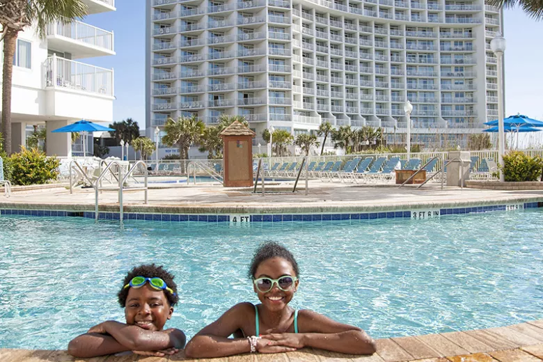 Sea Watch brother and sister in pool