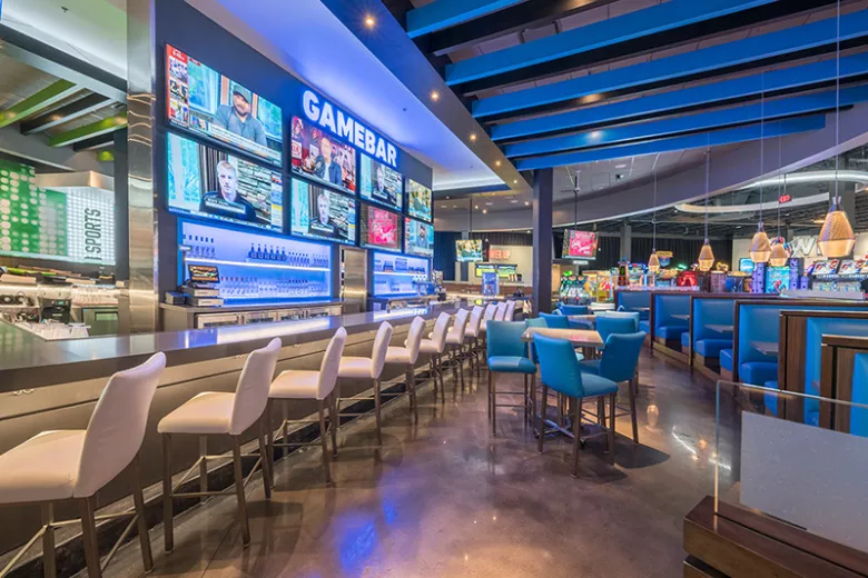 Dave and Busters bar area with large tvs