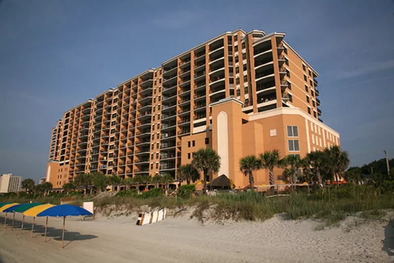 Island Vista beach with exterior building