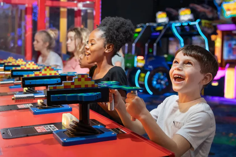 Coastal Grand Mall kids playing at At the Pier Arcade 