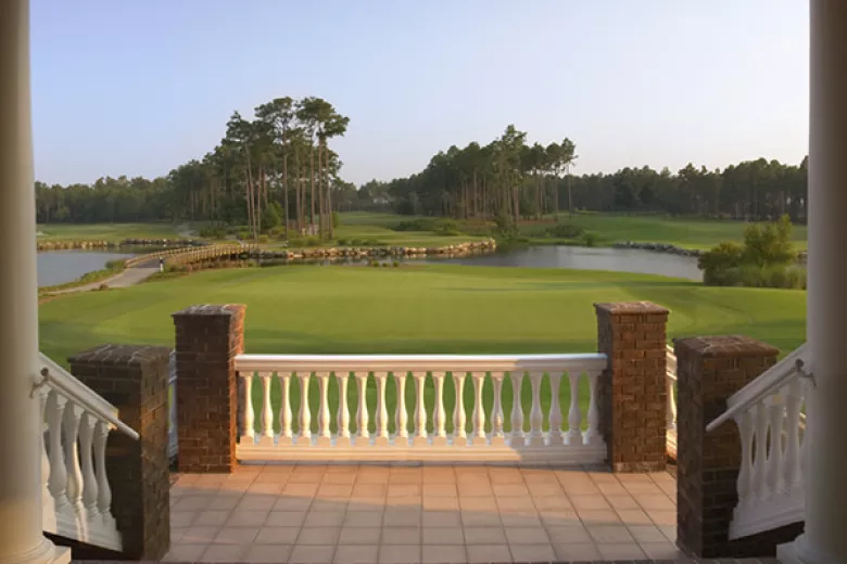 Lion's Paw view from clubhouse balcony greens with lake