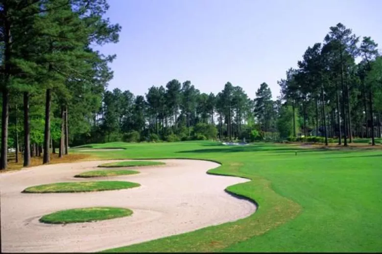 Southcreek fairway with large sandtrap and trees on left