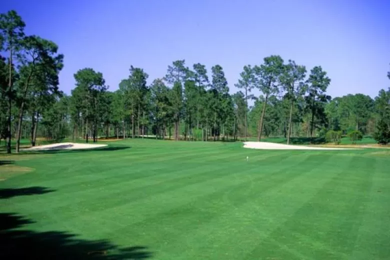 West Course fairway with traps and tees in the distance